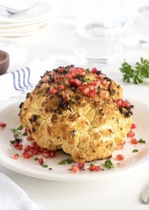 Whole Roasted Garlic and Herb Cauliflower with Pomegranate Seeds