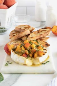 Grilled Brie with Peaches and Pesto